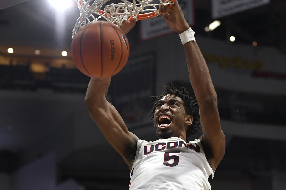 Connecticut's Isaiah Whaley dunks the ball in the second half of an NCAA college basketball game against Central Florida, Wednesday, Feb. 26, 2020, in Hartford, Conn. (AP Photo/Jessica Hill)