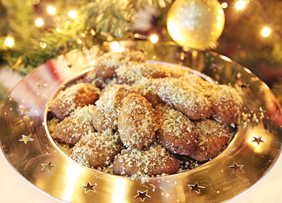 <p>Christmas is a huge holiday in Greece, and many religious people fast before, making the Christmas feast even more special. Some <a href="https://www.thespruceeats.com/greek-christmas-food-traditions-1705476" rel="nofollow noopener" target="_blank" data-ylk="slk:traditional foods;elm:context_link;itc:0;sec:content-canvas" class="link ">traditional foods</a> include <em>avgolemono</em>, a chicken and rice soup with an egg yolk and lemon base that is generally served as the first meal of the day; plus pork, stuffed cabbage; <em>Christopsomo</em>, which means "Christ's bread;" and baklava, a phyllo dough stuffed with a cinnamon-spiced nut filling. For dessert, <em>melomakarona</em> is extremely popular. This is a cookie made with cinnamon, cloves, and orange, dipped in a light syrup then sprinkled with nuts. These are often called "Christmas cookies."</p>