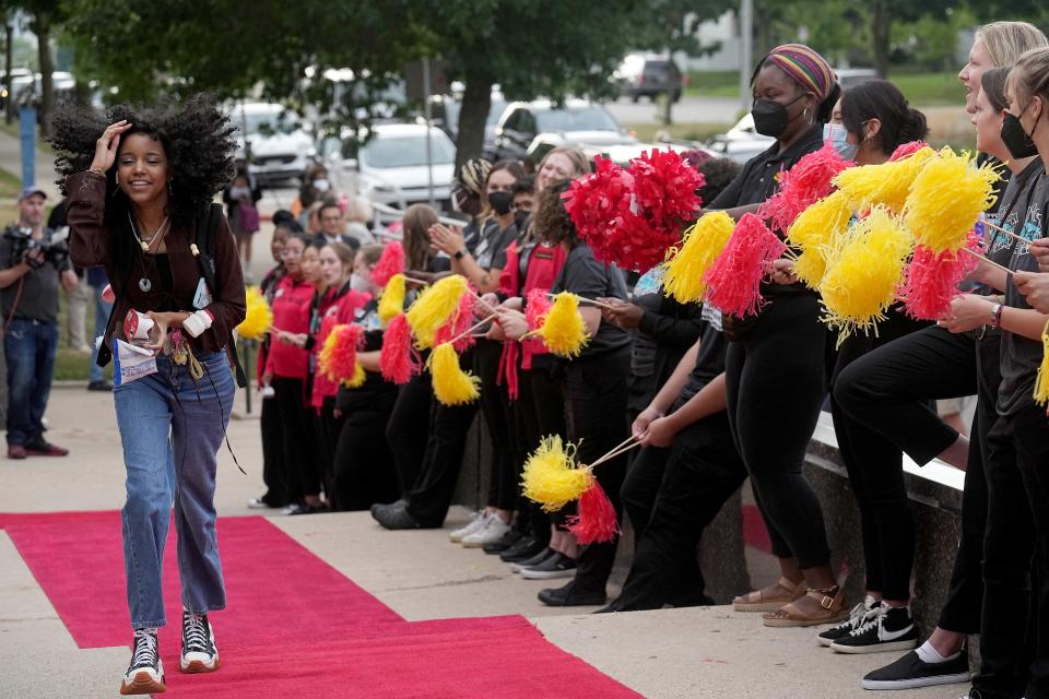 Students are greeted by cheering City Year service members at Milwaukee High School of the Arts, 2300 W. Highland Ave. Monday was the first day of the school year for the 1,100 students who attend the school. Milwaukee Public Schools follows the early start calendar for its high schools, middle schools and some elementary schools. Students on the traditional start calendar will begin Sept. 6.