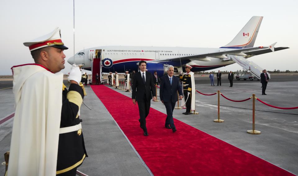 Canadian Prime Minister Justin Trudeau is greeted by Tunisian Minister of Defense Imed Memmich as Trudeau arrives in Djerba, Tunisia, Saturday, Nov. 19, 2022, to attend the Francophonie summit. (Sean Kilpatrick/The Canadian Press via AP)