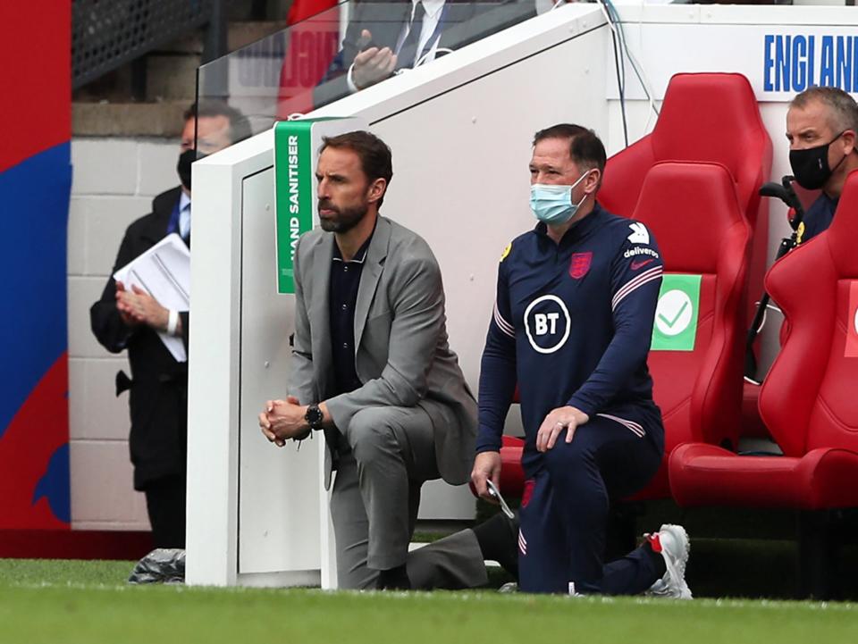 Gareth Southgate takes a knee ahead of kick-off (POOL/AFP via Getty Images)