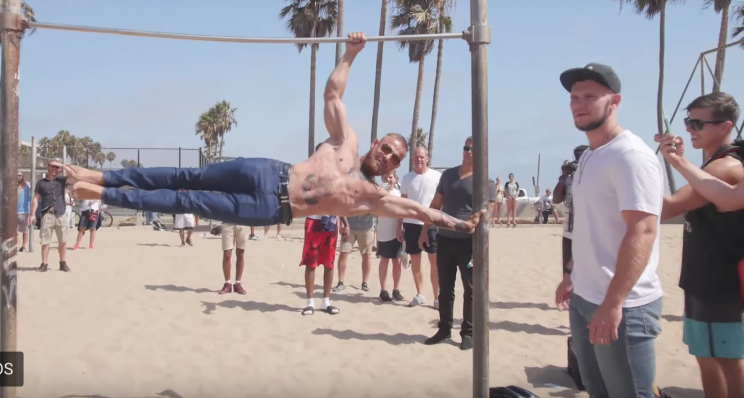 A Conor McGregor impersonator shows off his strength at Muscle Beach in Venice, California (YouTube).