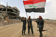 <p>Iraqi Federal Police celebrate in the Old City of Mosul, Iraq, July 8, 2017. (Photo: Ahmed Saad/Reuters) </p>