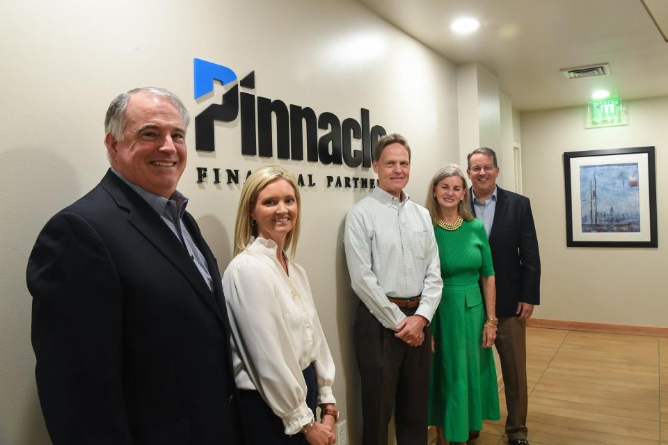 Pinnacle's Knoxville leaders pose at the Northshore Drive tower. To get hired, bankers need a personal recommendation from a Pinnacle employee, a long record of success and a team spirit.