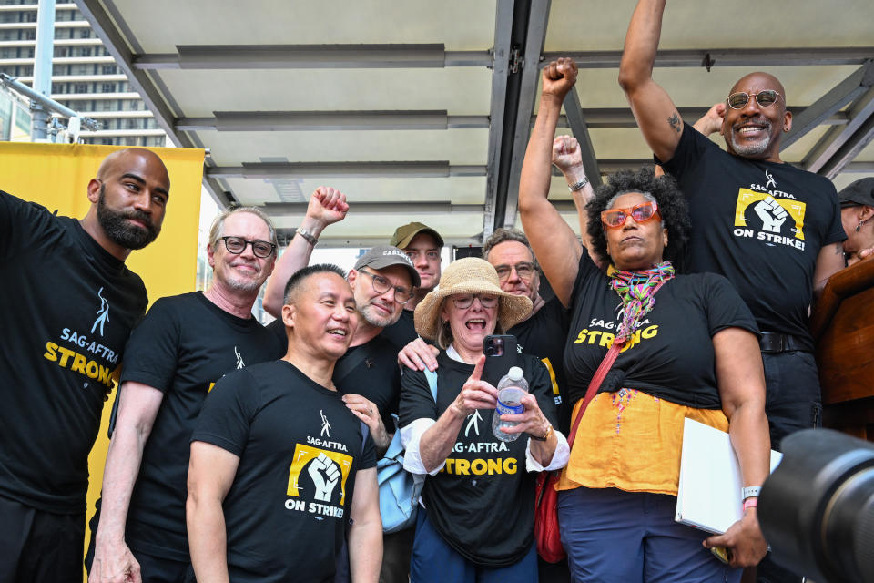 NEW YORK, NEW YORK - JULY 25: Steve Buscemi, BD Wong, Christian Slater, Brendan Fraser, Bryan Cranston, Nancy Giles and Ezra Knight are seen on stage during  the "Rock The City For A Fair Contract" rally in Times Square on July 25, 2023 in New York City. Members of SAG-AFTRA, Hollywood's largest union which represents actors and other media professionals, have joined striking WGA (Writers Guild of America) workers in the first joint walkout against the studios since 1960. The strike could shut down Hollywood productions completely with writers in the third month of their strike against the Hollywood studios.  (Photo by Alexi Rosenfeld/Getty Images)