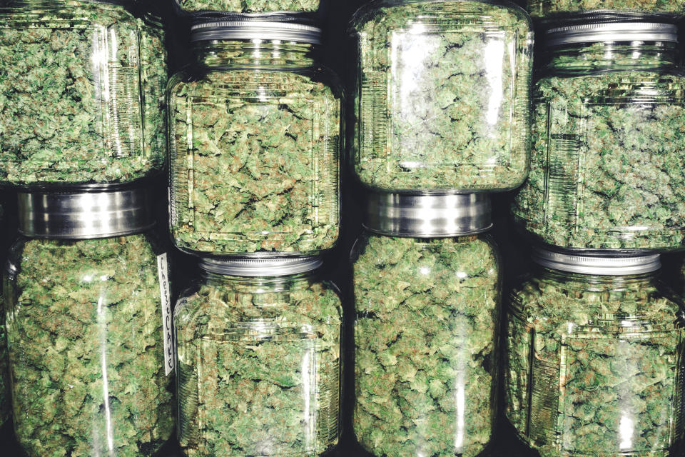 Marijuana in stacked mason jars.