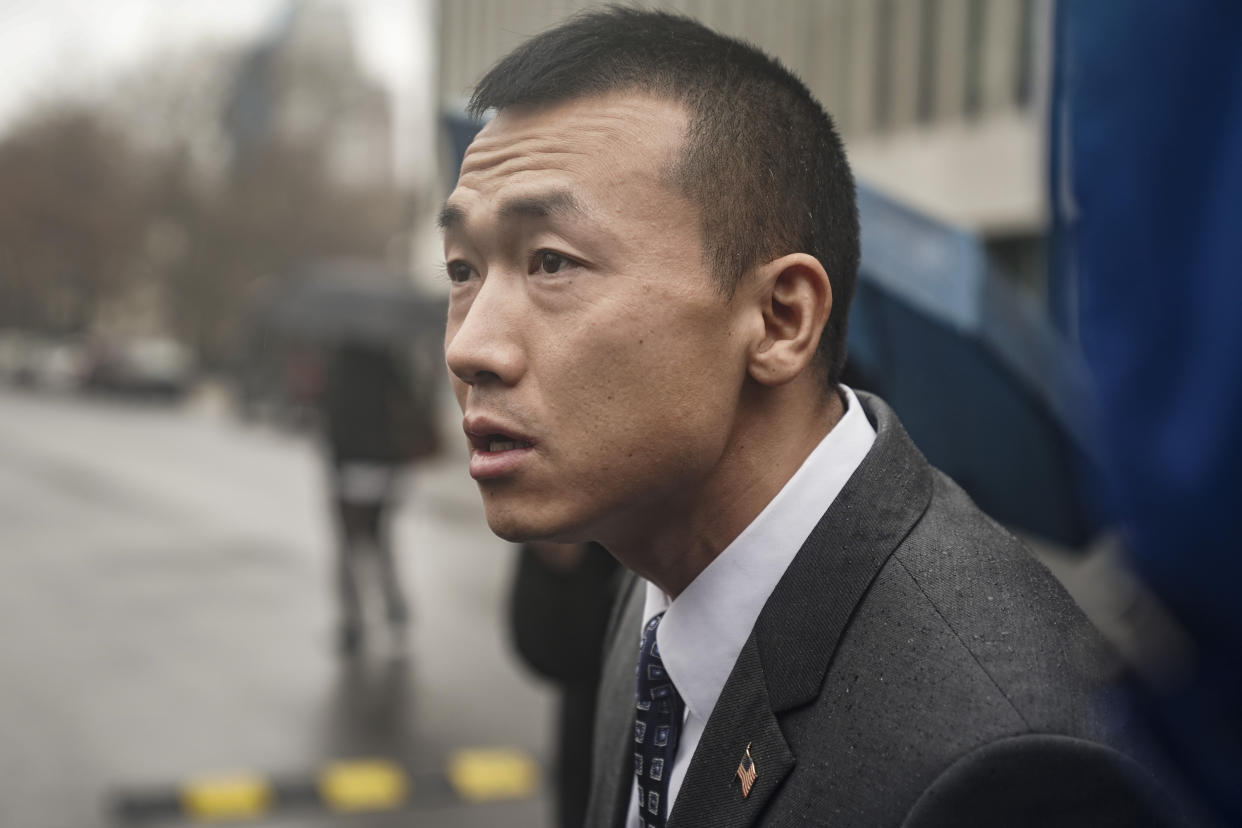 NYPD officer Baimadajie Angwang, a naturalized US citizen from Tibet, speaks during a press briefing outside Brooklyn's Federal court after a judge dismissed spy charges against him, Thursday Jan. 19, 2023, in New York. U.S. prosecutors dropped charges against Angwang, who authorities had initially accused of spying on independence-minded Tibetans on behalf of the Chinese consulate in New York. (AP Photo/Bebeto Matthews)