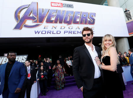 Actor Liam Hemsworth poses with his wife Miley Cyrus pose on the red carpet at the world premiere of the film "The Avengers: Endgame" in Los Angeles, California, April 22, 2019. REUTERS/Mario Anzuoni