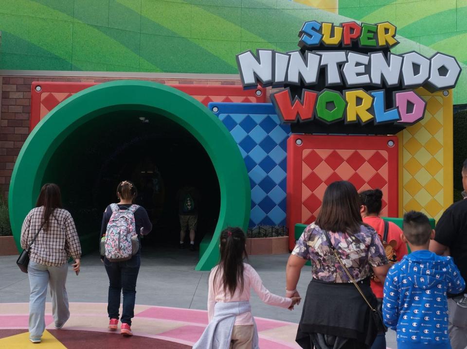 Guests walk towards the entrance during a preview of Super Nintendo World at Universal Studios in Los Angeles, California, on January 13, 2023.