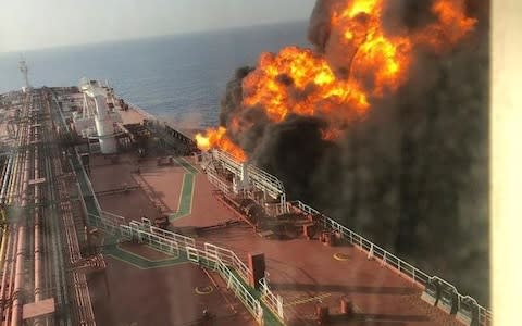 The fire rages on board one of the tankers - Credit: Fars News Agency