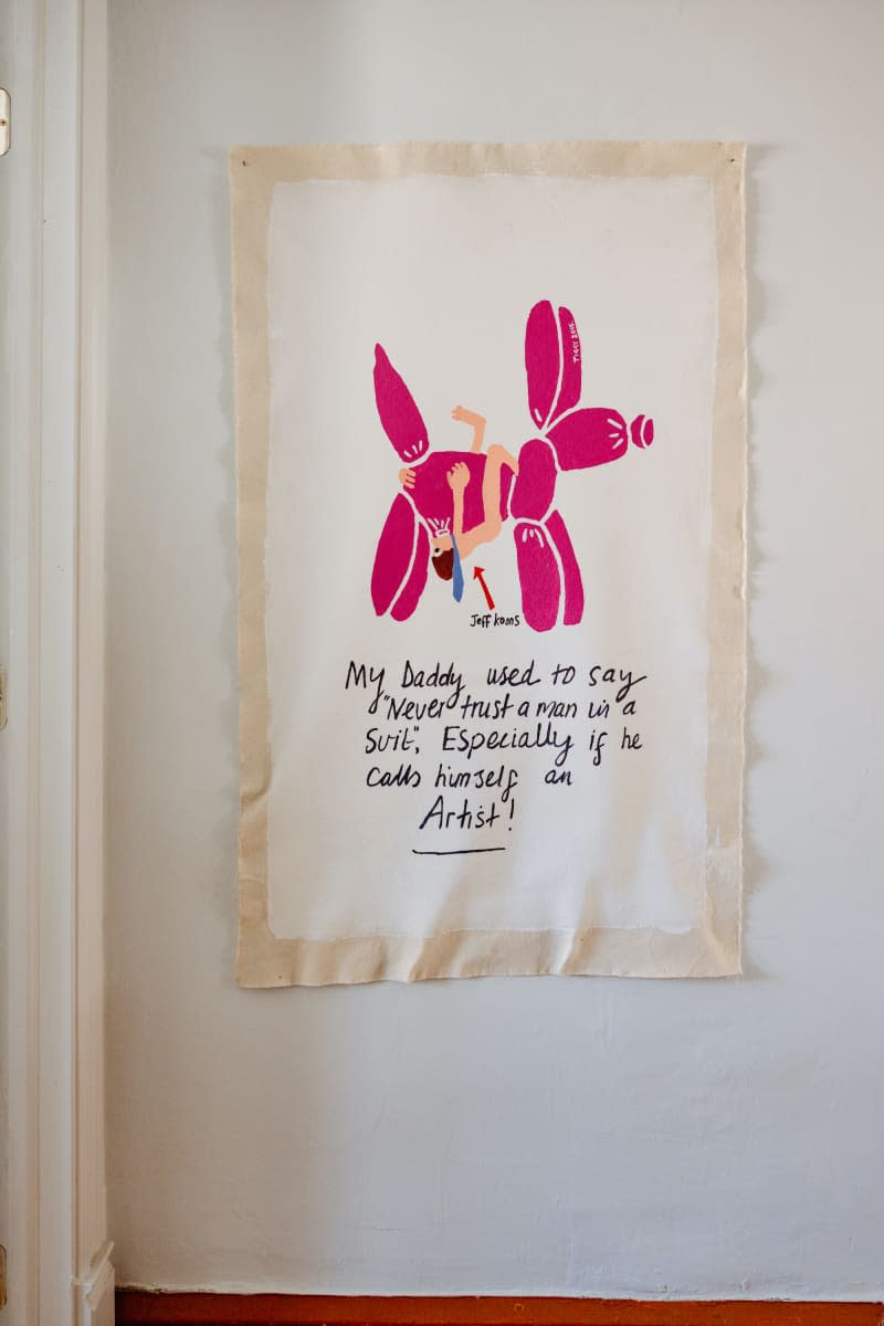 Art featuring Jeff Koons balloon dog hangs on white wall.