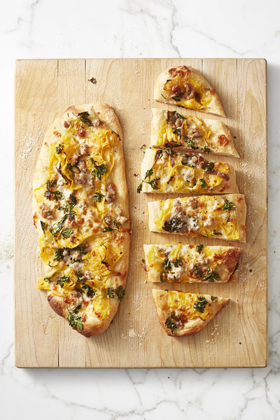 <p>If you haven't used butternut squash in place of sauce, then Turkey Day is the perfect time. </p><p>Get the <a href="https://www.goodhousekeeping.com/food-recipes/a45678/harvest-flatbreads-italian-sausage-recipe/" rel="nofollow noopener" target="_blank" data-ylk="slk:Harvest Flatbreads with Italian Sausage recipe;elm:context_link;itc:0;sec:content-canvas" class="link "><strong>Harvest Flatbreads with Italian Sausage recipe</strong></a>.</p>