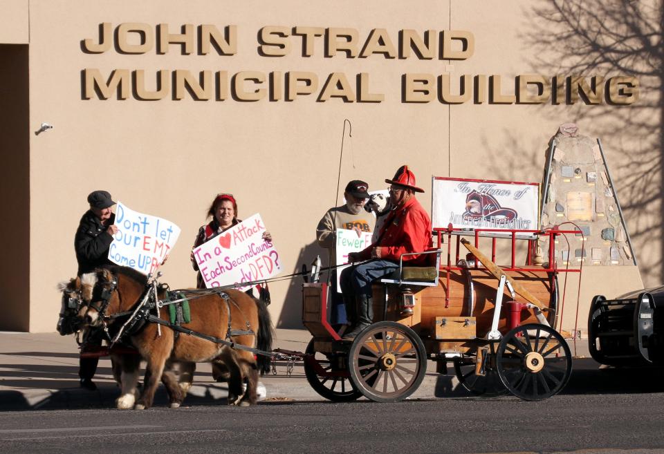 Monday's demonstration drew plenty of attention from passersby in front of the John Strand Municipal Building at 309 S. Gold St.