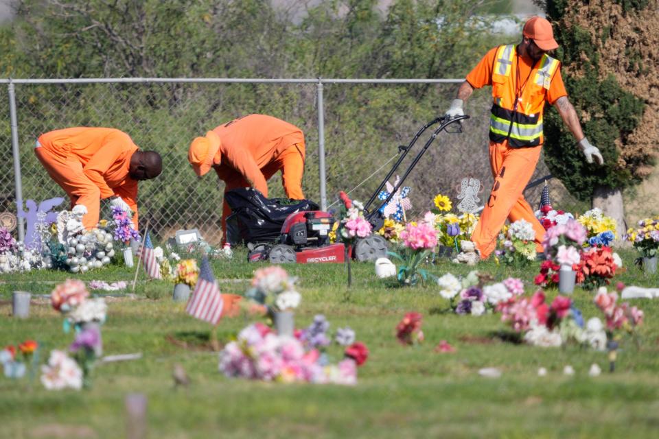 Prison laborers work at Sunset Cemetery in Willcox on June 22, 2022.
