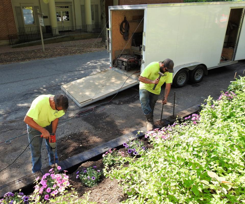 Workers of the City of Coshocton affix railroad ties along the side of Whitewoman Street in Roscoe Village as part of a renovation project. The city recently received $60,000 in the capital budget specifically for fixing sidewalks with new bricks. In all, the county received more than $300,000/ Our Town Coshocton will get $45,000 for the Selby Building revitalization and $200,000 is going to the Coshocton County Connector.