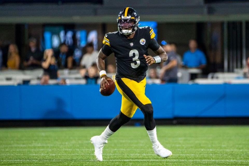 CHARLOTTE, NC - AUGUST 27: Dwayne Haskins #3 of the Pittsburgh Steelers rolls out of the pocket against the Carolina Panthers during the first half of an NFL preseason game at Bank of America Stadium on August 27, 2021 in Charlotte, North Carolina. (Photo by Chris Keane/Getty Images)