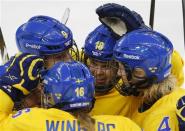 Sweden's Anna Borgqvist (C) celebrates with her teammates after scoring against Team USA during the third period of their women's ice hockey semi-final game at the Sochi 2014 Winter Olympic Games February 17, 2014. REUTERS/Laszlo Balogh