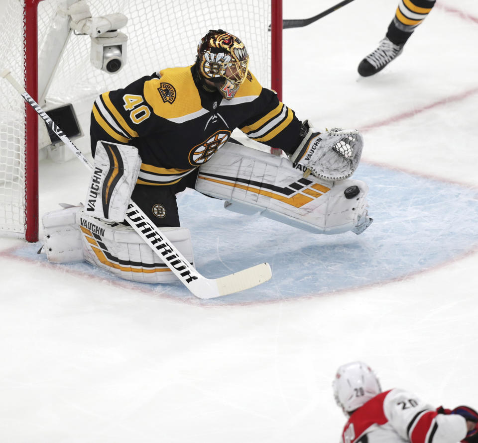 Boston Bruins goaltender Tuukka Rask (40), of Finland, makes a toe save on a shot by Carolina Hurricanes' Sebastian Aho (20), of Finland, during the first period in Game 1 of the NHL hockey Stanley Cup Eastern Conference finals, Thursday, May 9, 2019, in Boston. (AP Photo/Charles Krupa)