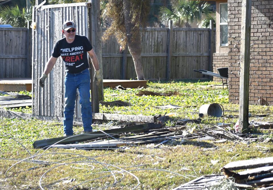 Matthew Baker who lives at the corner of Silver Street and Beach Drive was busy picking up and around his yard on Wednesday morning.