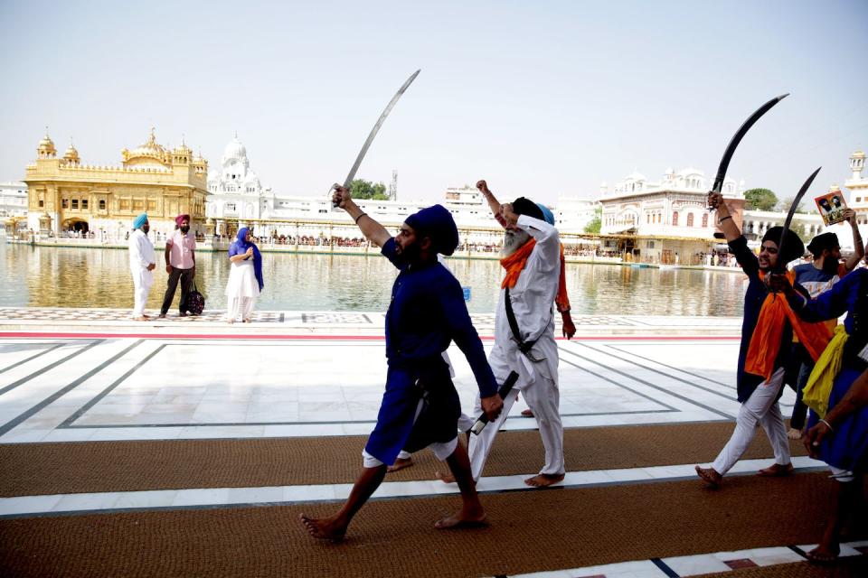 Sikh separatists shout pro-Khalistan slogans and brandish swords after a memorial in 2019 for those killed during Operation Blue Star in 1984. Raminder Pal Singh