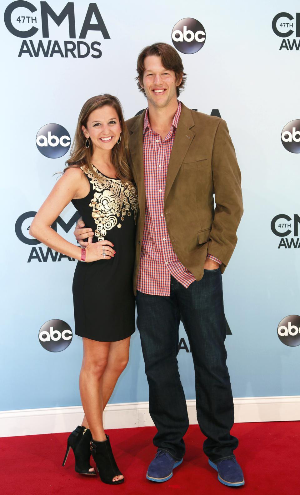 Clayton Kershaw and his wife Ellen pose on arrival at the 47th Country Music Association Awards in Nashville, Tennessee November 6, 2013. REUTERS/Eric Henderson (UNITED STATES - Tags: ENTERTAINMENT)