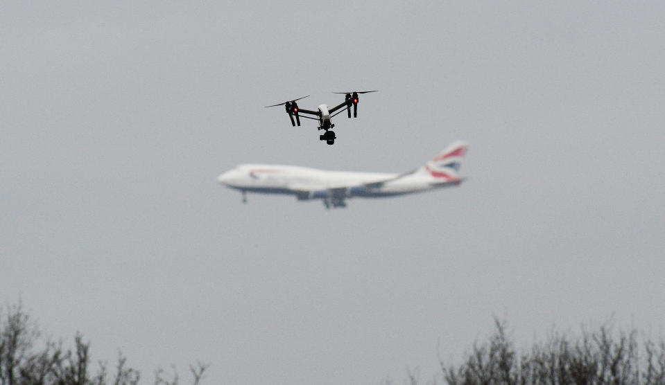 A drone flies in Hanworth Park in west London, as a British Airways 747 plane prepares to land at Heathrow Airport behind. Archive image. (PA)