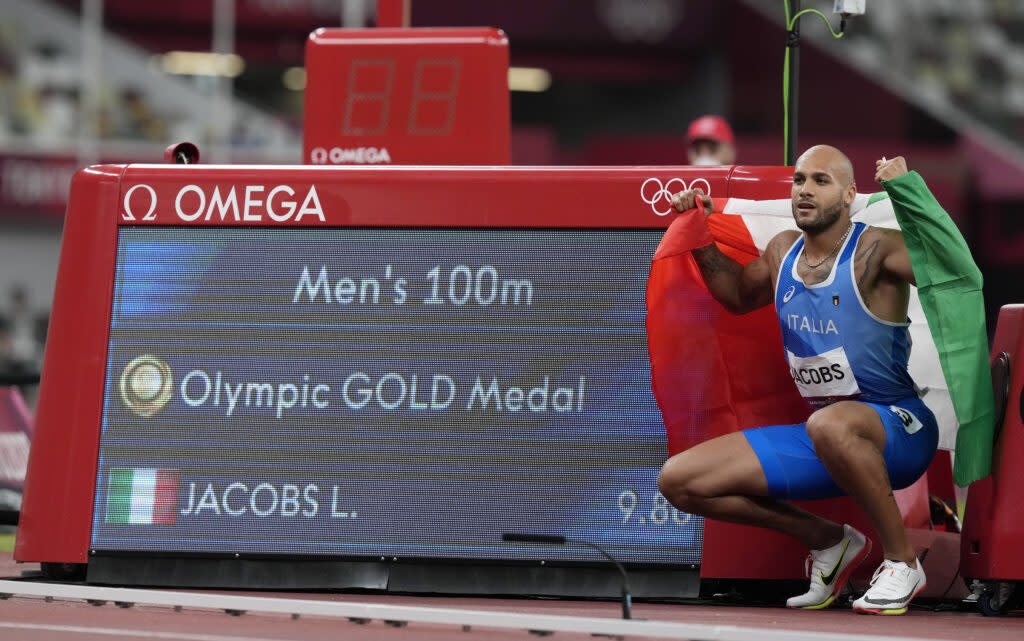 Lamont Marcell Jacobs, of Italy celebrates after winning the gold medal in the final of the men’s 100-meters at the 2020 Summer Olympics, Sunday, Aug. 1, 2021, in Tokyo, Japan. (AP Photo/Martin Meissner)