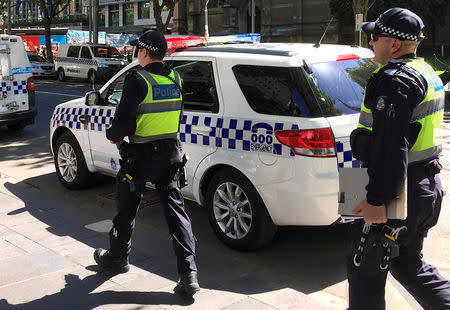 Australian police patrol the area where a driver on Thursday deliberately ploughed into pedestrians in central Melbourne, Australia, December 22, 2017. REUTERS/Sonali Paul