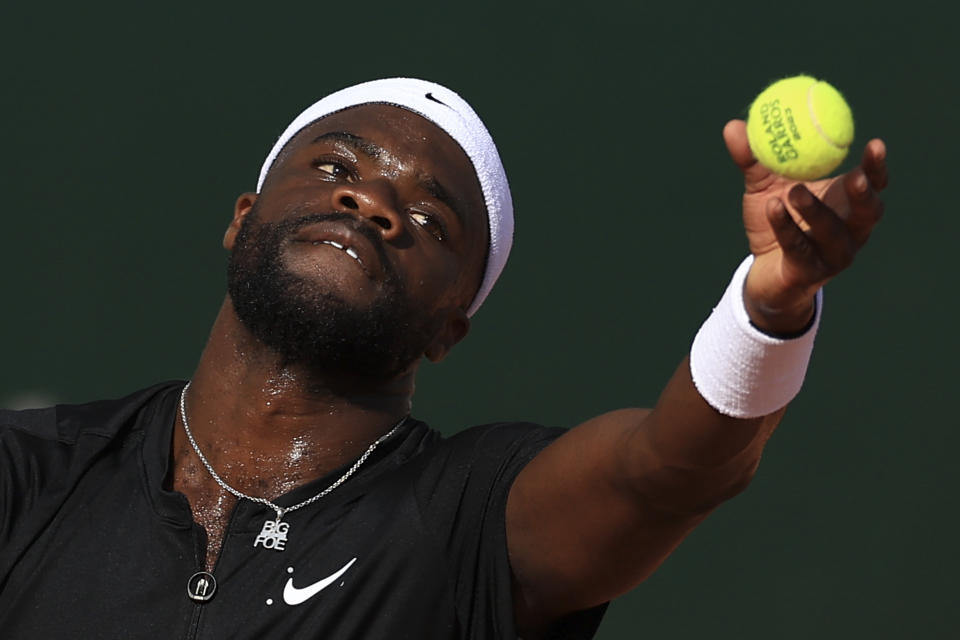 FILE - Frances Tiafoe serves against Serbia's Filip Krajinovic during their first round match of the French Open tennis tournament at the Roland Garros stadium in Paris, Monday, May 29, 2023. Tiafoe is one of the men to watch at the U.S. Open, which begins at Flushing Meadows on Aug. 28.(AP Photo/Aurelien Morissard, File)