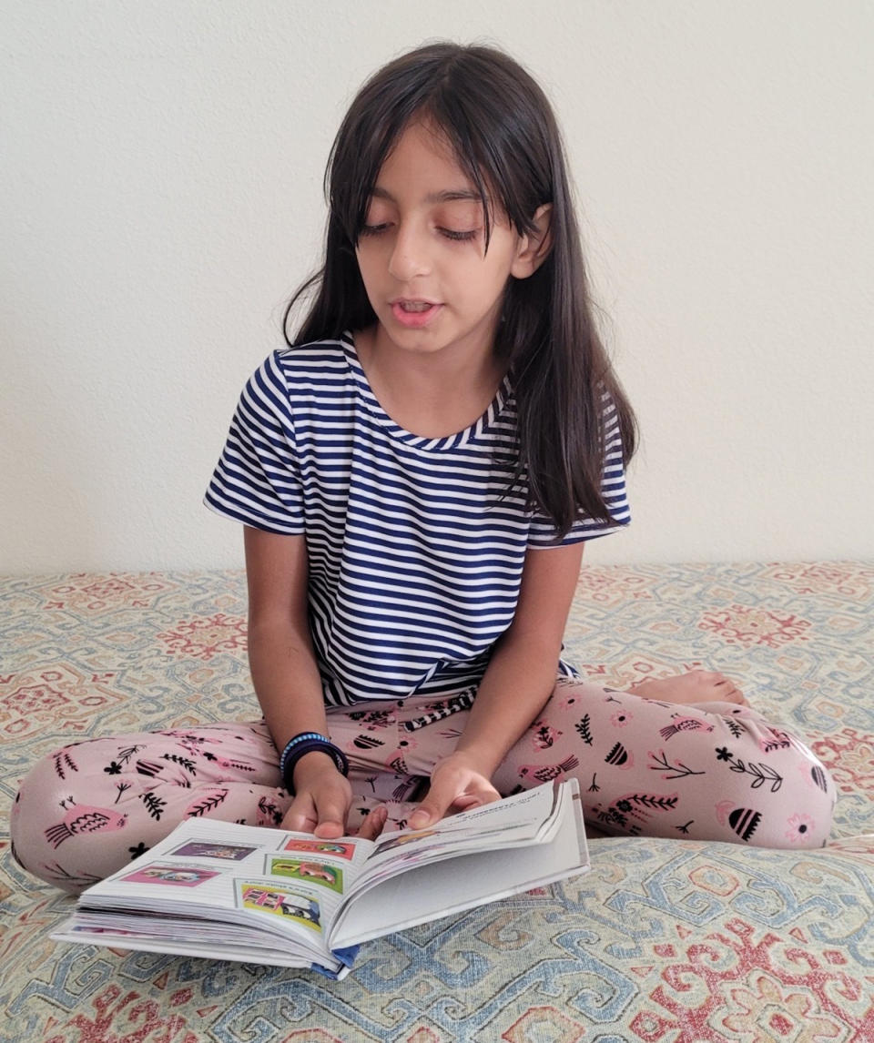 Esra Sadat, 7 and in the second grade, excels in math and reading. Her favorite book, <em>Yasmin!</em>, by author Saadia Faruqi, follows a curious little girl from a close-knit Pakistani-American family. Esra is quite like her, her mother said. (Kaynat Sadat)