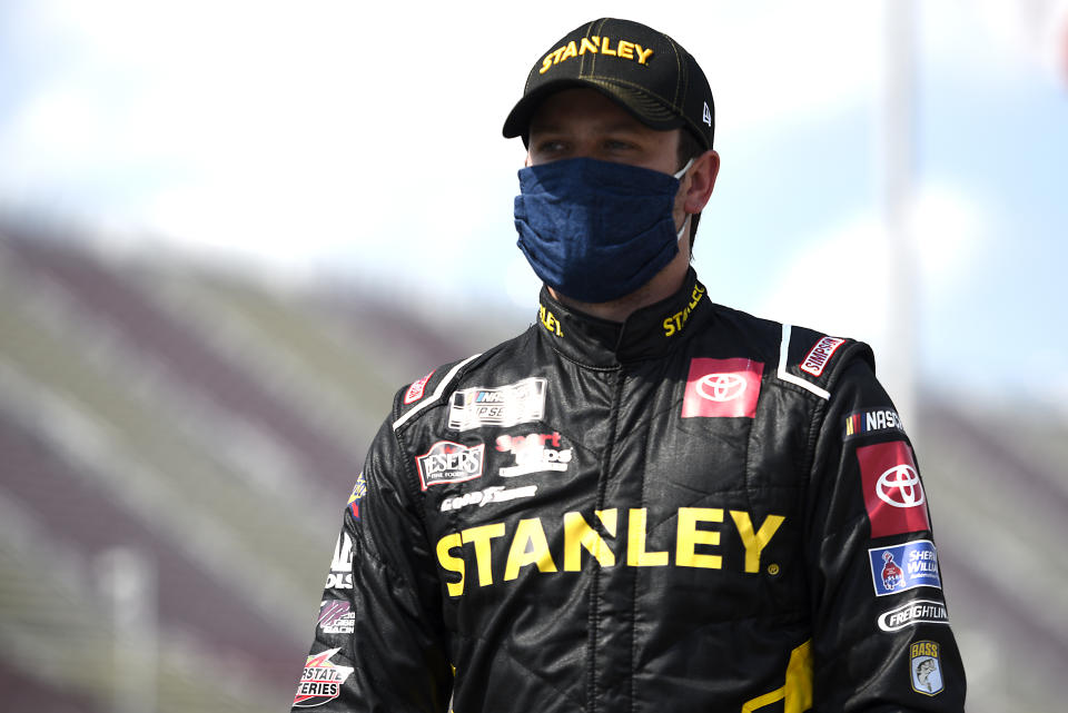 BROOKLYN, MICHIGAN - AUGUST 09: Erik Jones, driver of the #20 STANLEY Toyota, walks the grid prior to the NASCAR Cup Series Consumers Energy 400 at Michigan International Speedway on August 09, 2020 in Brooklyn, Michigan. (Photo by Jared C. Tilton/Getty Images)