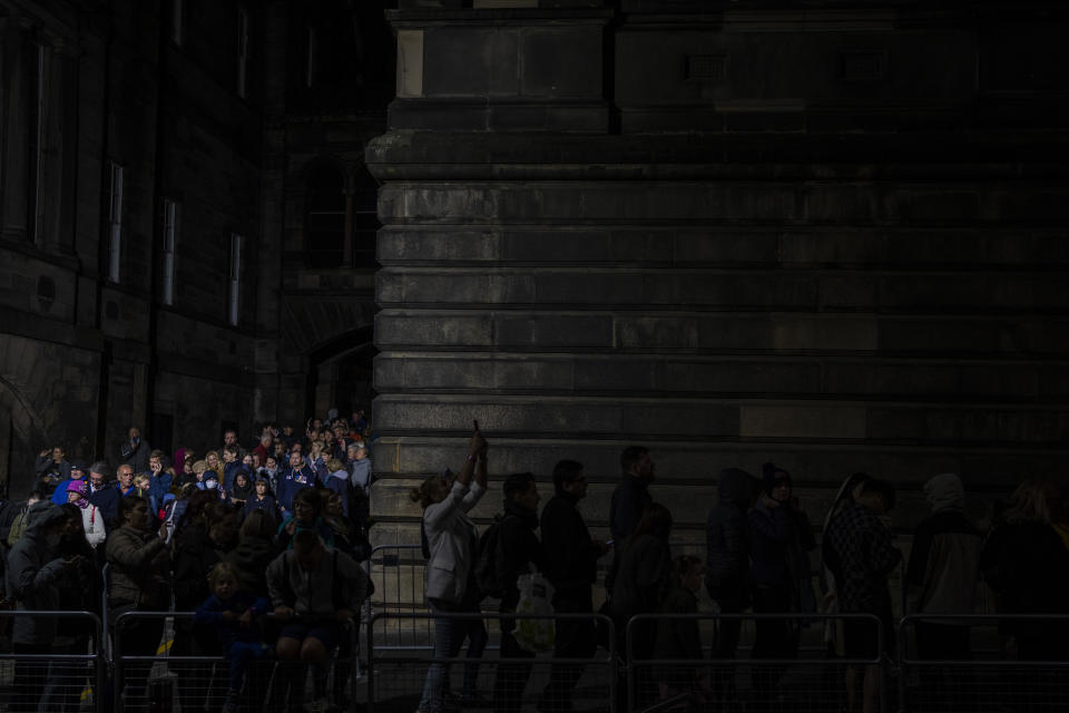 People queue to see the coffin of Queen Elizabeth II as she lies at rest at St Giles Cathedral in Edinburgh, Scotland, Monday Sept. 12, 2022. Britain's longest-reigning monarch who was a rock of stability across much of a turbulent century, died Thursday, Sept. 8, after 70 years on the throne. She was 96. (AP Photo/Bernat Armangue)