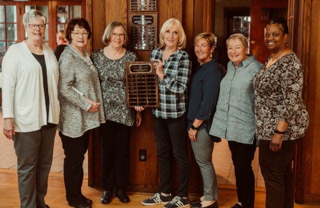 Pat Gates, in the center holding plaque, stands with past winners of the YWCA of Alliance's Fullmer Volunteer Leadership award, from left, Karen Locke, Kathy Stroia, Barb Richmond, Nancy Castellucci, Leigh Mainwaring and Renee Young. Gates was awarded the prize Saturday, March 13, 2024, during the YWCA's 98th annual meeting.