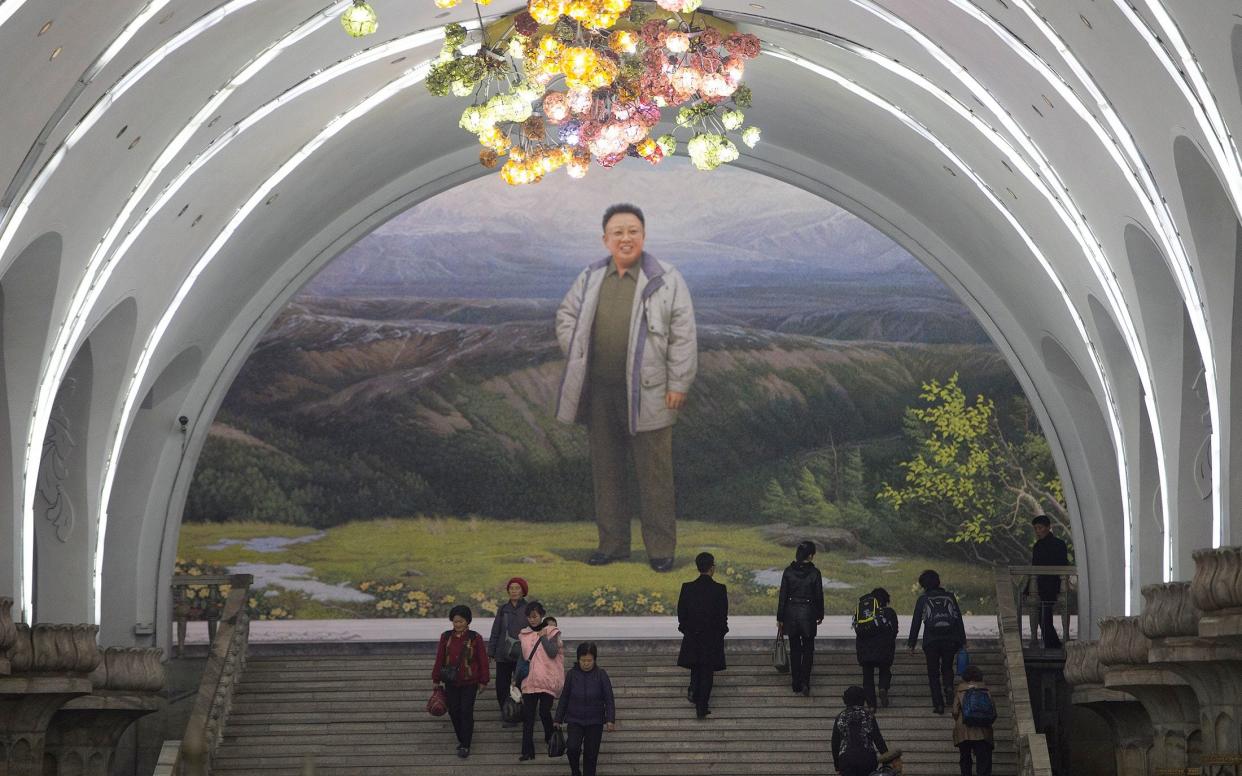 Kim Jong-il greets residents at one of Pyonyang's subway entrances - Â© Eddie Mulholland