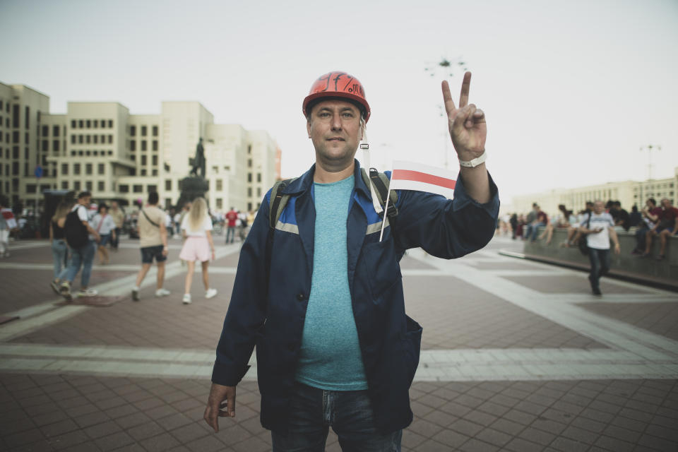 Pavel Stavpinskiy, 43, a worker who was an election observer during the last presidential election poses for a photo during an opposition rally in Independence Square in Minsk, Belarus, Monday, Aug. 17, 2020. (AP Photo/Evgeniy Maloletka)