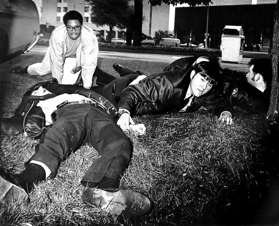 <div class="inline-image__caption"><p>Larry Williams, on the far top left, on January 7, 1973 at what has become known as the Howard Johnson Massacre in New Orleans. A Black terrorist used a sniper rifle to fatally shoot police officers that he lured to the Civic Center, known as Duncan Plaza.</p></div> <div class="inline-image__credit">Courtesy of Larry Williams</div>