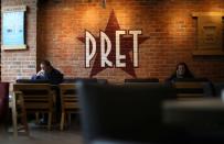 FILE PHOTO: Customers sit inside a Pret A Manger store in Liverpool