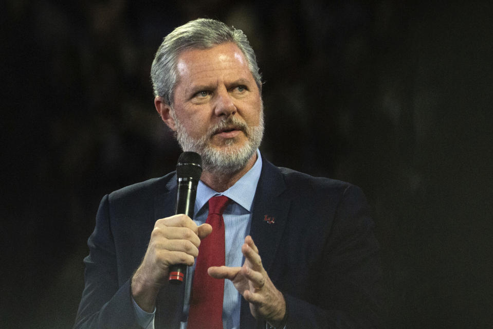 FILE - In this, Nov. 13 2019, file photo, Liberty University President Jerry Falwell Jr. talks to Donald Trump Jr. about his new book "Triggered" during convocation at Liberty University in Lynchburg, Va. Falwell Jr. said Tuesday, Aug. 25, 2020, that he has resigned as head of evangelical Liberty University because of ongoing controversies about his wife’s sexual involvement with a younger business partner and in the wake of a social media photo that caused an uproar. (Emily Elconin/The News & Advance via AP, File)