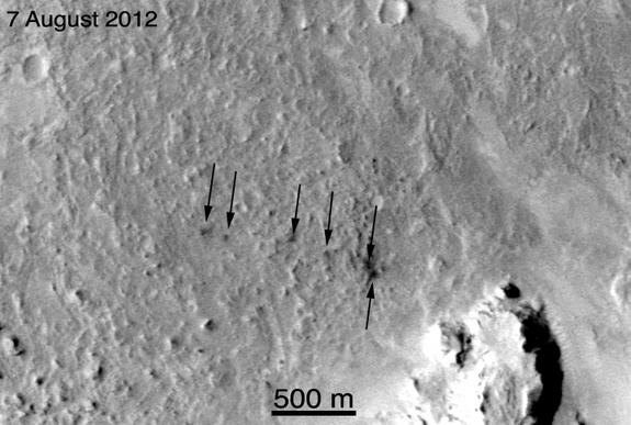 This image from NASA's Mars Reconnaissance Orbiter shows the six craters created by the ejection of tungsten slugs during the Curiosity Mars rover's landing on Aug. 5, 2012.