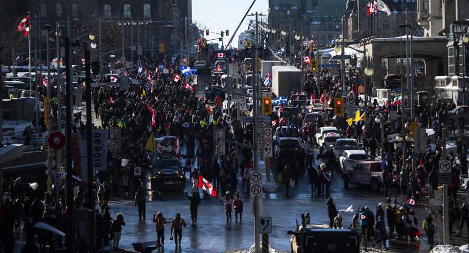 People and vehicles fill Wellington Street near Parliament Hill during a rally against Covid vaccine mandates.