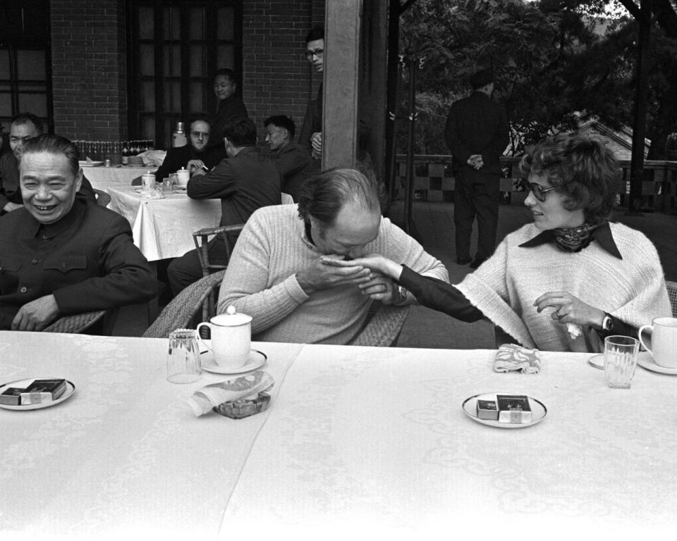 Former prime minister Pierre Trudeau sniffs the fragrance in the hand of his wife Margaret while visiting the Fragrant Hills Park and Summer Palace at the foot of the Western Mountains in the Haidian District, in the northwestern part of Beijing, China, on Oct. 12, 1973. THE CANADIAN PRESS/PETER BREGG