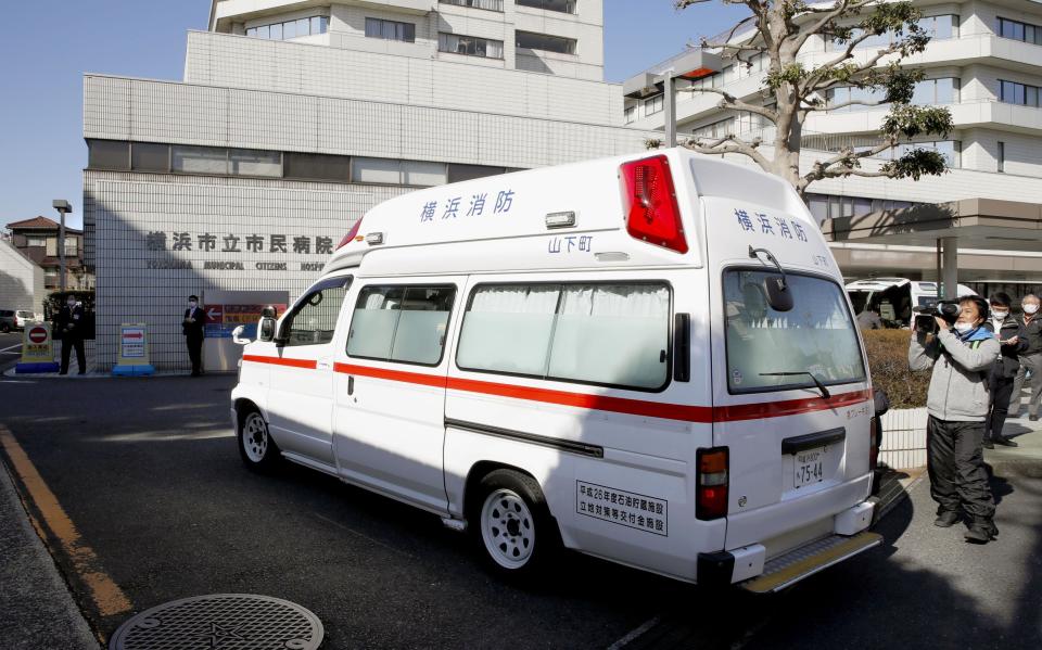 In this Feb. 5, 2020, photo, an ambulance carrying a passenger onboard cruise ship Diamond Princess arrives at a hospital in Yokohama, near Tokyo. Hospitals in Japan are increasingly turning away sick people in ambulances as the country braces for a surge in coronavirus infections. The Japanese Association for Acute Medicine and the Japanese Society for Emergency Medicine say emergency medicine has already collapsed with many hospitals refusing to treat people including those suffering strokes, heart attacks and external injuries. (Kyodo News via AP)(Sadayuki Goto/Kyodo News via AP)