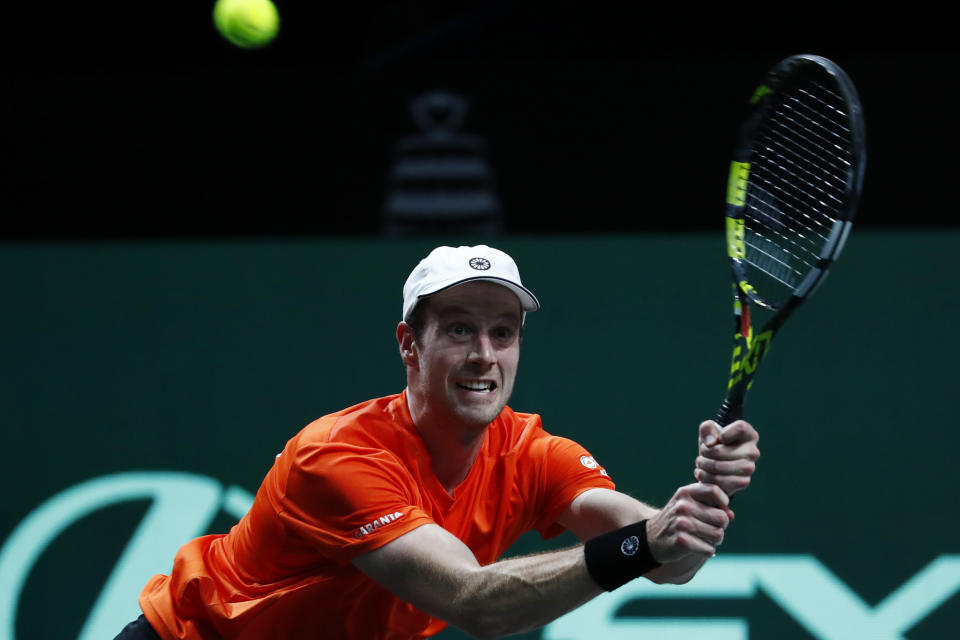 Netherland's Botic van de Zandschulp returns the ball to Australia's Alex de Minaur during a Davis Cup quarter-final tennis match between Australia and The Netherlands in Malaga, Spain, Tuesday, Nov. 22, 2022. (AP Photo/Joan Monfort)