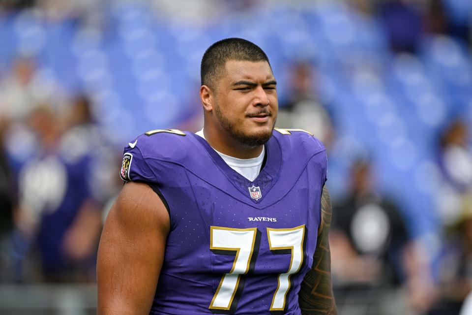 Baltimore Ravens offensive tackle Daniel Faalele (77) looks on during pre-game warm-ups before an NFL football game against the Houston Texans, Sunday, Sept. 10, 2023, in Baltimore. (AP Photo/Terrance Williams)