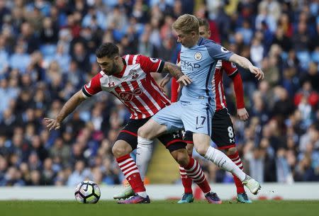 Manchester City v Southampton - Premier League - Etihad Stadium - 23/10/16 Manchester City's Kevin De Bruyne in action with Southampton's Charlie Austin Action Images via Reuters / Craig Brough Livepic