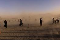 People play at the cricket park in Kabul