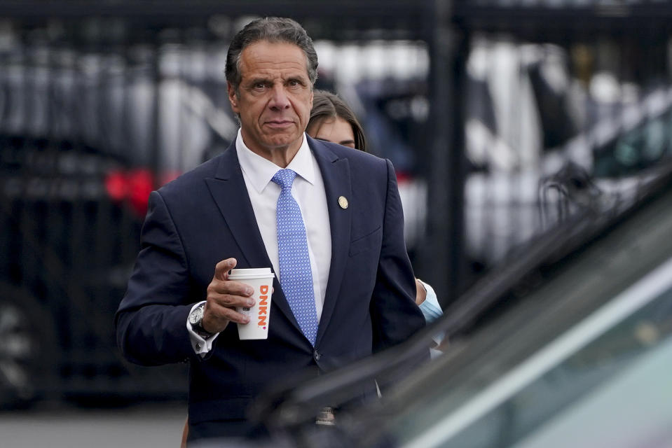 FILE - New York Gov. Andrew Cuomo prepares to board a helicopter after announcing his resignation, Aug. 10, 2021, in New York. Charlotte Bennett, a onetime aide to former New York Gov. Andrew Cuomo who accused him of sexual harassment in a federal lawsuit filed a separate lawsuit Wednesday, March 15, 2023, against the state. Bennett filed a complaint in state court in Manhattan saying her former employer, the state of New York, is liable for Cuomo’s sexual harassment and for the actions of his top aides, who failed to take corrective action once she reported it. (AP Photo/Seth Wenig, File)