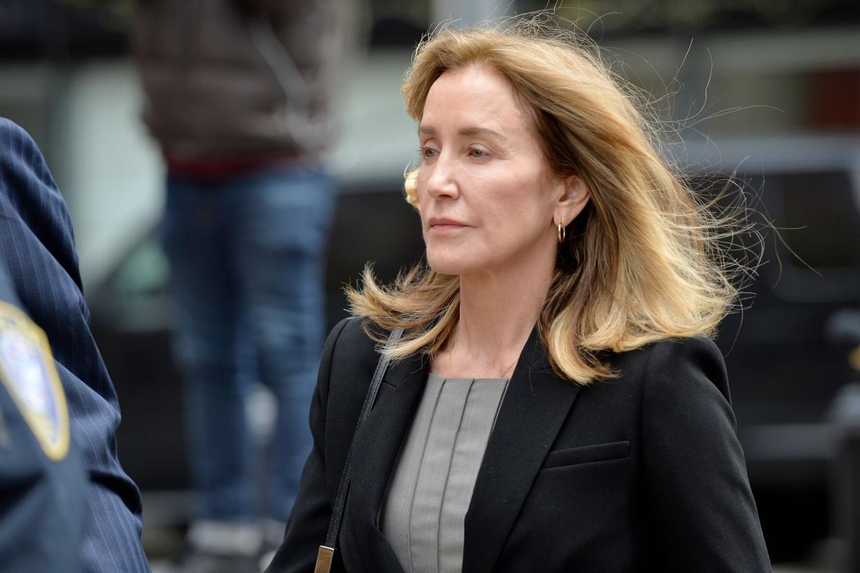 Actress Felicity Huffman is escorted by Police into court where she is expected to plead guilty to one count of conspiracy to commit mail fraud and honest services mail fraud before Judge Talwani at John Joseph Moakley United States Courthouse in Boston, Massachusetts, May 13, 2019. (Photo by Joseph Prezioso / AFP)        (Photo credit should read JOSEPH PREZIOSO/AFP/Getty Images)