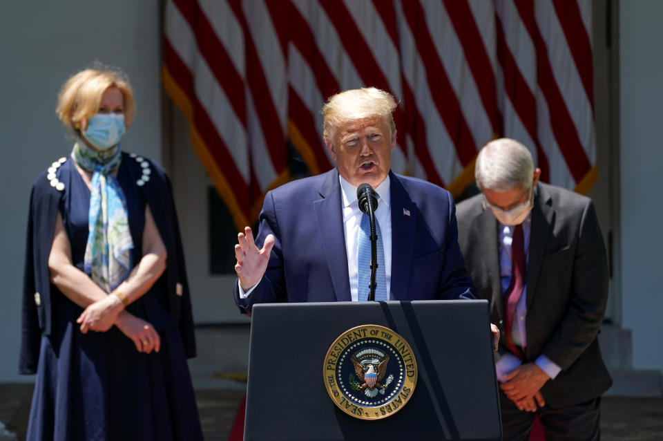 U.S. President Donald Trump speaks about administration efforts to develop a coronavirus vaccine as Dr. Debbie Birx, the White House coronavirus response coordinator, and National Institute of Allergy and Infectious Diseases Director Dr. Anthony Fauci listen during a coronavirus disease (COVID-19) pandemic response event in the Rose Garden at the White House in Washington, U.S., May 15, 2020. REUTERS/Kevin Lamarque