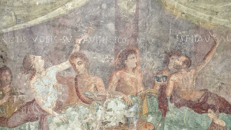 Roman fresco depicting a dinner party. 